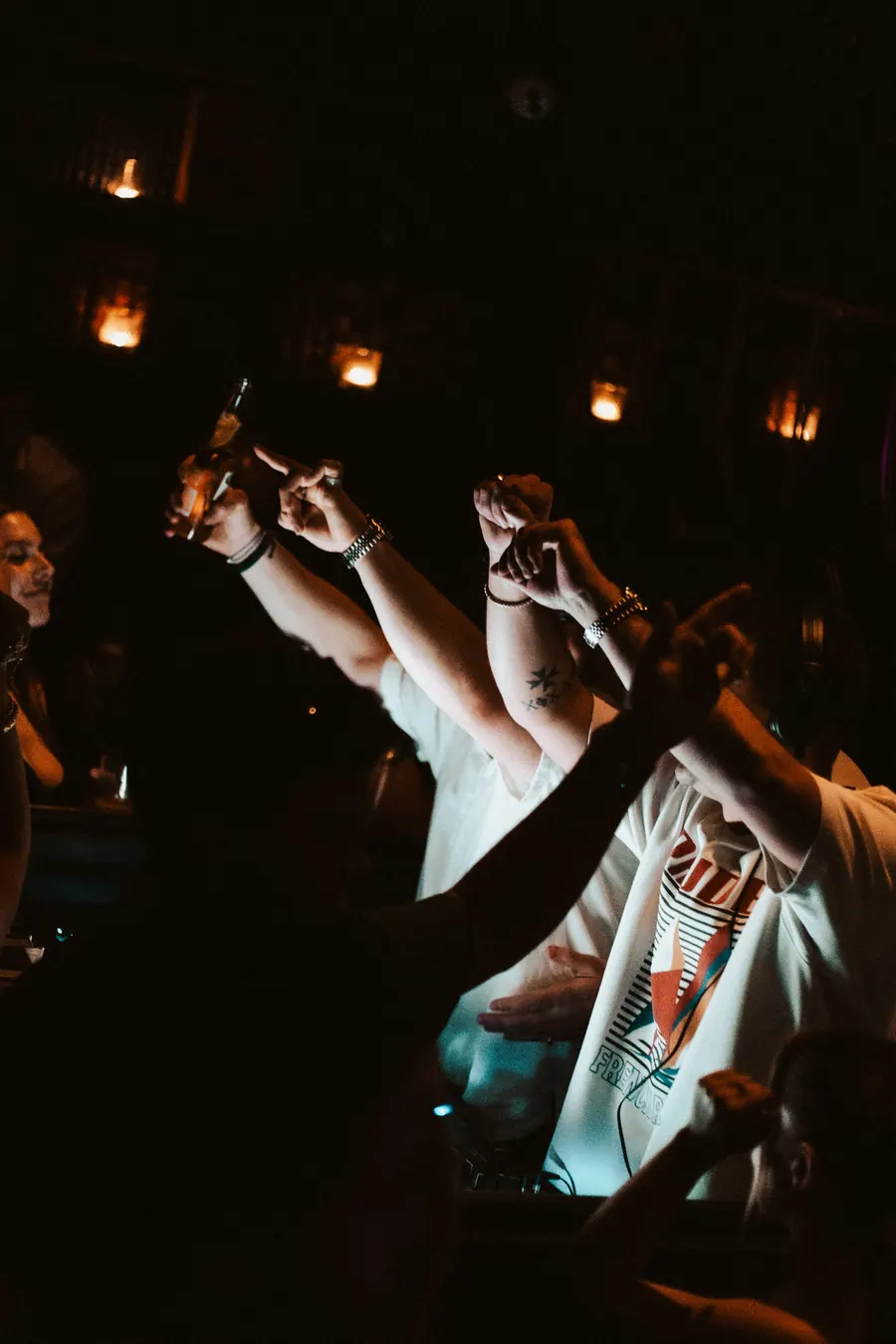Hands in the air on a dark Toronto dance floor